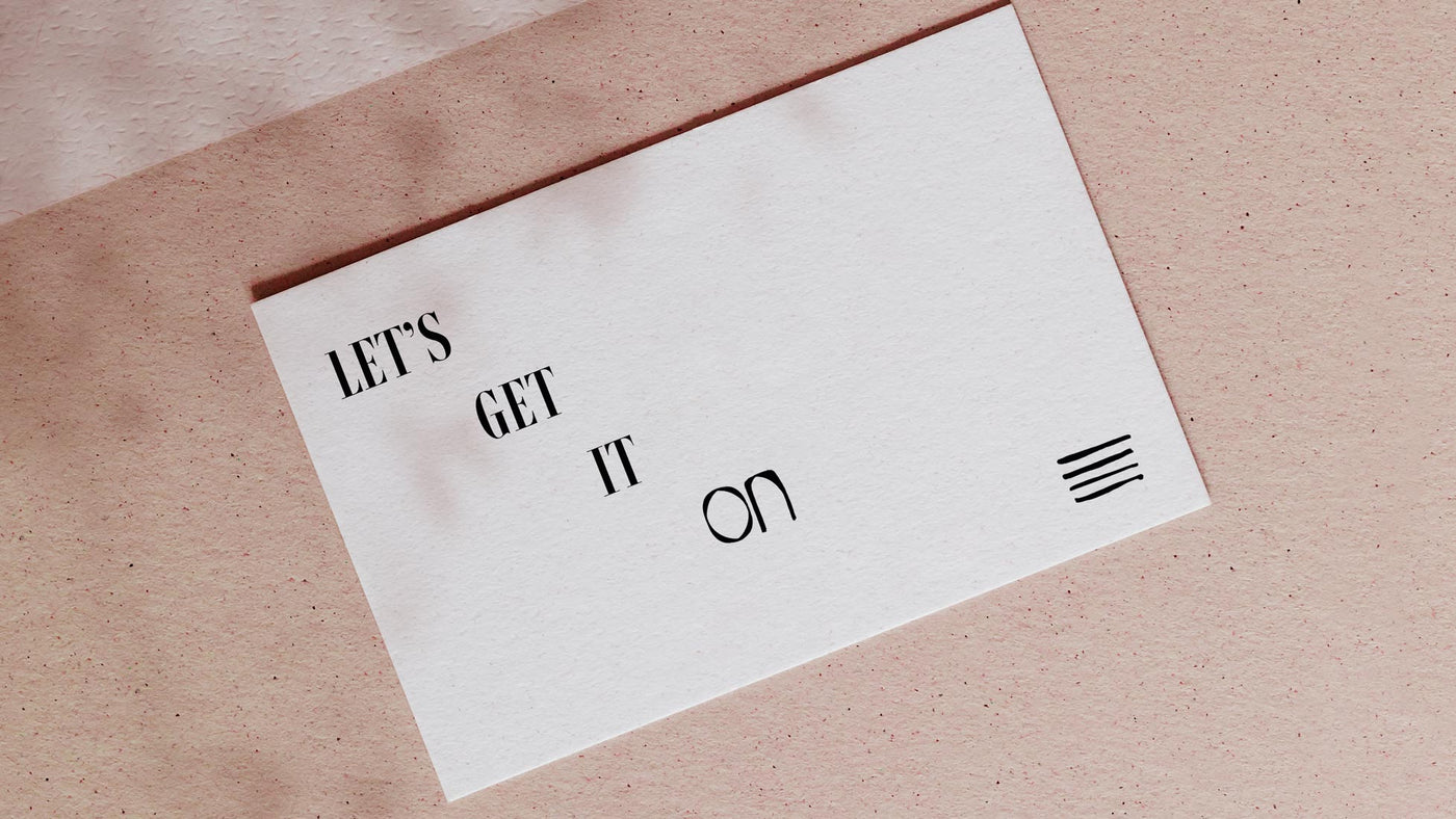 White card with the words Let's Get It On and the On Paper Lab logo.
